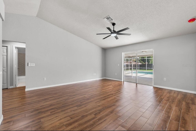6528 Shepherd Oaks Pass, Lakeland, FL 33811 - unfurnished room featuring lofted ceiling, ceiling fan, dark wood-style floors, and a textured ceiling