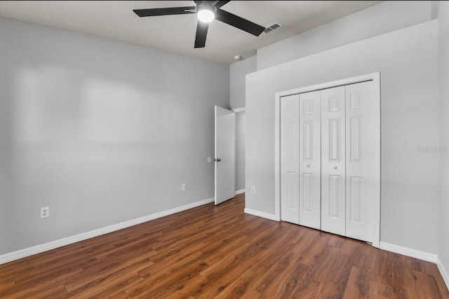 6528 Shepherd Oaks Pass, Lakeland, FL 33811 - unfurnished bedroom featuring dark wood-style floors, a closet, and ceiling fan