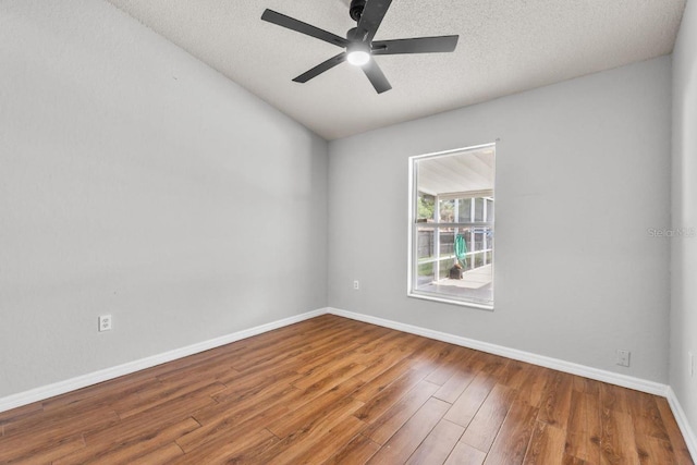 6528 Shepherd Oaks Pass, Lakeland, FL 33811 - empty room featuring wood finished floors, a ceiling fan, and a textured ceiling