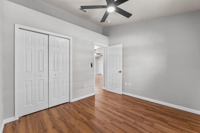 6528 Shepherd Oaks Pass, Lakeland, FL 33811 - unfurnished bedroom with wood finished floors, a closet, and a ceiling fan