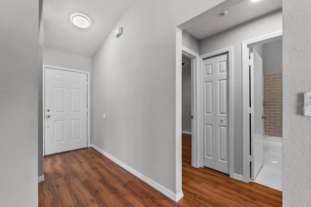 6528 Shepherd Oaks Pass, Lakeland, FL 33811 - corridor with wood finished floors and baseboards