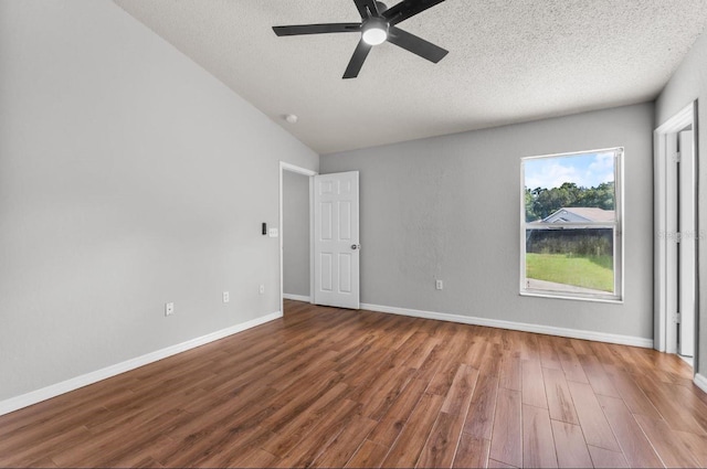 6528 Shepherd Oaks Pass, Lakeland, FL 33811 - empty room with wood finished floors, ceiling fan, a textured ceiling, and lofted ceiling