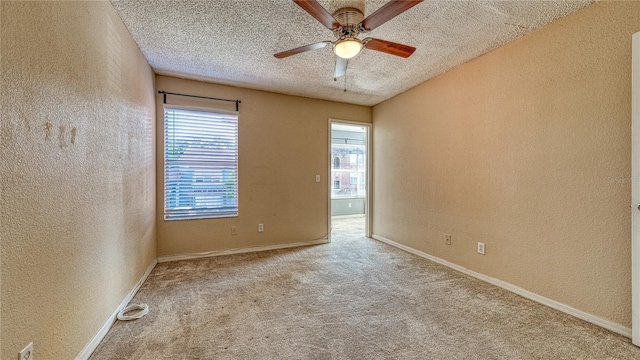 5112 Conroy Rd Unit 24, Orlando, FL 32811 - carpeted empty room featuring a textured wall, a ceiling fan, and a textured ceiling