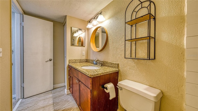 5112 Conroy Rd Unit 24, Orlando, FL 32811 - bathroom featuring a textured wall, a textured ceiling, and vanity