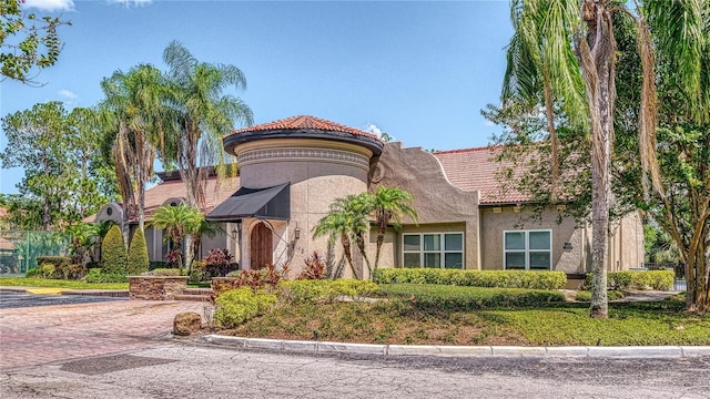 5112 Conroy Rd Unit 24, Orlando, FL 32811 - view of front of house with a tile roof and stucco siding