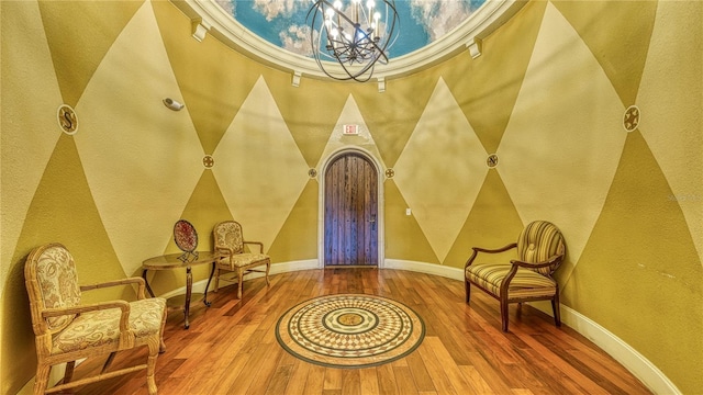 5112 Conroy Rd Unit 24, Orlando, FL 32811 - living area with a chandelier, hardwood / wood-style floors, and a textured wall