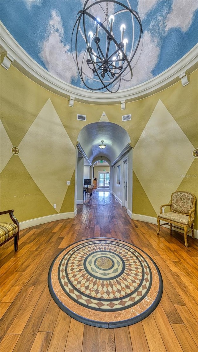 5112 Conroy Rd Unit 24, Orlando, FL 32811 - entrance foyer with arched walkways, hardwood / wood-style floors, and a chandelier