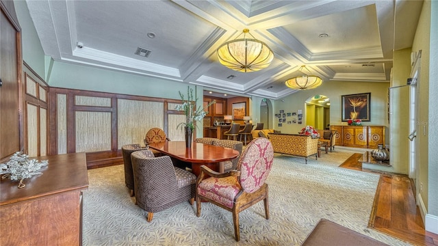5112 Conroy Rd Unit 24, Orlando, FL 32811 - dining area featuring arched walkways, coffered ceiling, ornamental molding, carpet flooring, and beamed ceiling