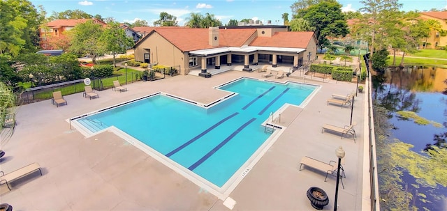 5112 Conroy Rd Unit 24, Orlando, FL 32811 - community pool with a patio and a water view