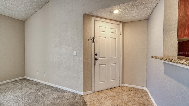 5112 Conroy Rd Unit 24, Orlando, FL 32811 - foyer with a textured ceiling and light tile patterned flooring
