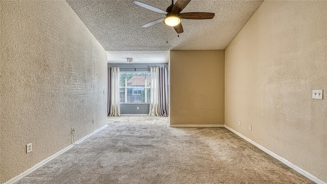 5112 Conroy Rd Unit 24, Orlando, FL 32811 - empty room featuring a textured wall, a ceiling fan, a textured ceiling, and carpet flooring