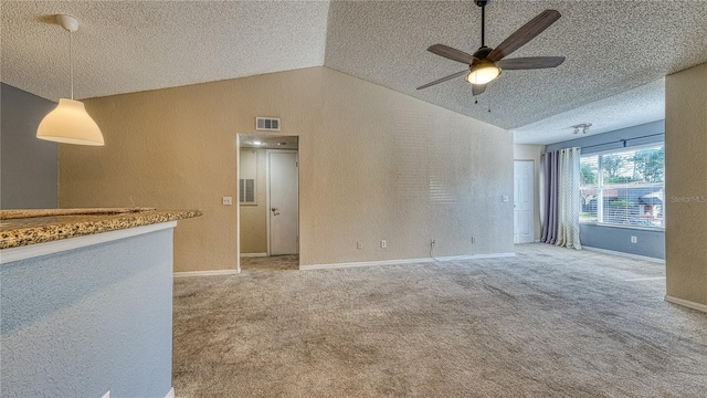 5112 Conroy Rd Unit 24, Orlando, FL 32811 - carpeted empty room featuring a ceiling fan, vaulted ceiling, a textured ceiling, and a textured wall