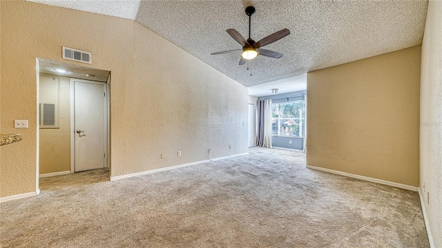 5112 Conroy Rd Unit 24, Orlando, FL 32811 - empty room featuring a textured wall, a textured ceiling, a ceiling fan, lofted ceiling, and carpet