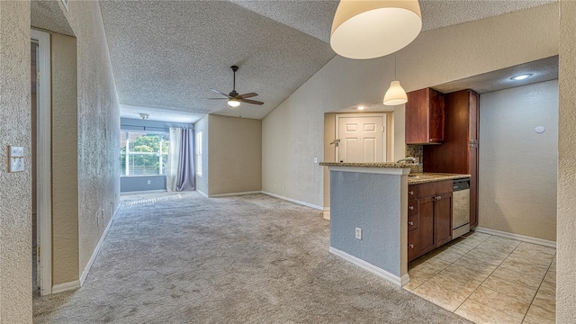 5112 Conroy Rd Unit 24, Orlando, FL 32811 - kitchen with a textured wall, a textured ceiling, a ceiling fan, stainless steel dishwasher, and lofted ceiling
