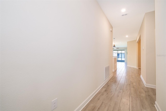 1173 Trappers Trail Loop, Champions Gate, FL 33896 - hall featuring light wood finished floors and recessed lighting