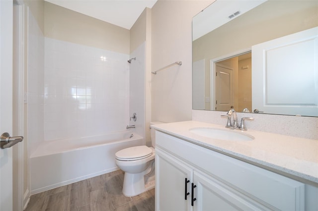 1173 Trappers Trail Loop, Champions Gate, FL 33896 - full bath featuring vanity, washtub / shower combination, and wood finished floors