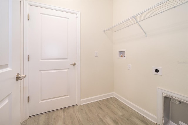 1173 Trappers Trail Loop, Champions Gate, FL 33896 - laundry area with washer hookup, hookup for an electric dryer, and light wood-type flooring