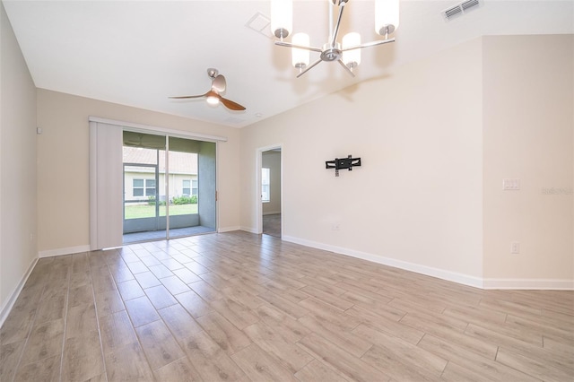 1173 Trappers Trail Loop, Champions Gate, FL 33896 - unfurnished room with light wood-style flooring, a chandelier, and ceiling fan