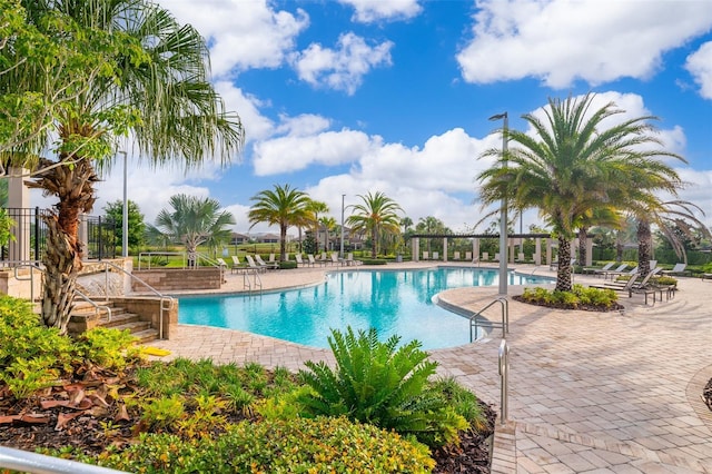 1173 Trappers Trail Loop, Champions Gate, FL 33896 - community pool featuring a patio area
