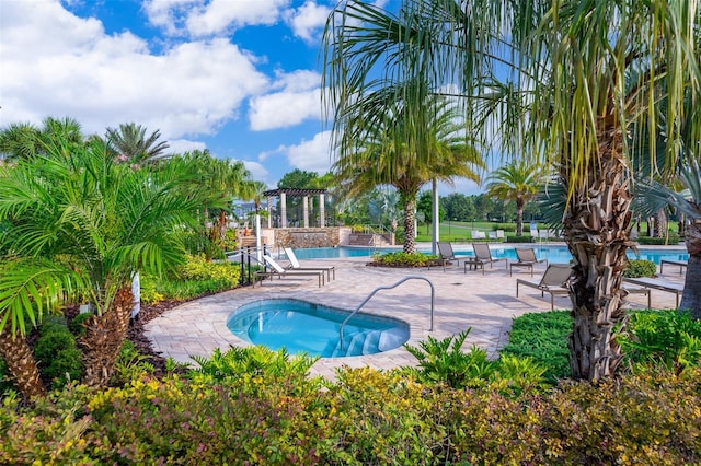1173 Trappers Trail Loop, Champions Gate, FL 33896 - community pool with a community hot tub and a patio area