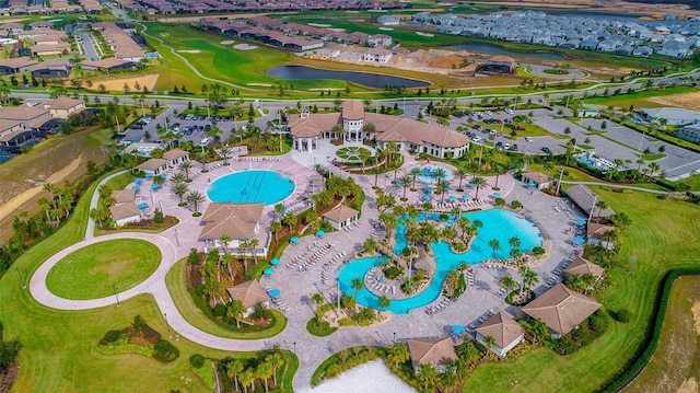 1173 Trappers Trail Loop, Champions Gate, FL 33896 - aerial perspective of suburban area with a nearby body of water and a golf club