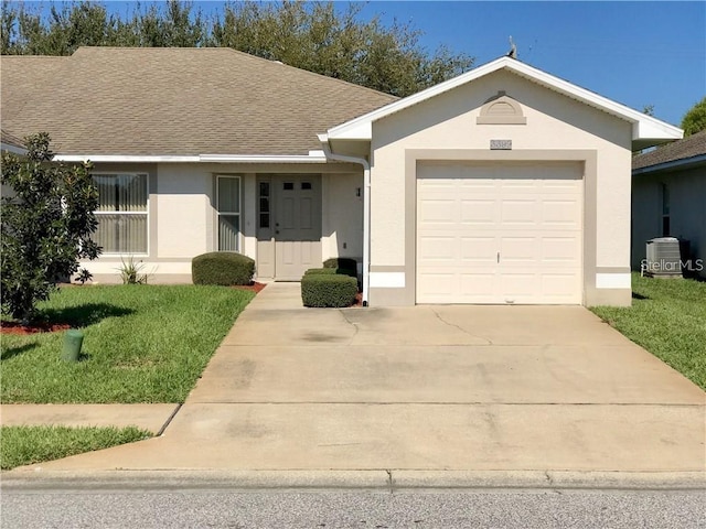 3399 Celena Cir, Saint Cloud, FL 34769 - ranch-style house featuring concrete driveway, a garage, stucco siding, and a front yard
