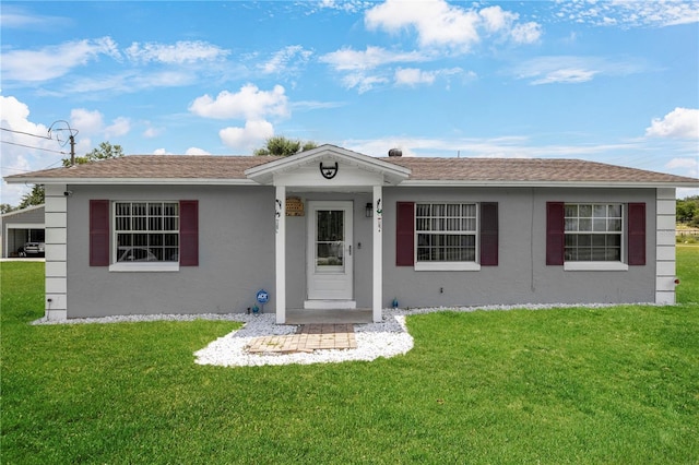 1 Coyer Rd, Haines City, FL 33844 - ranch-style home featuring a front yard, stucco siding, and a shingled roof