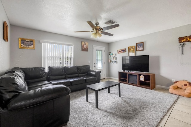 1 Coyer Rd, Haines City, FL 33844 - living area featuring a ceiling fan and light tile patterned flooring