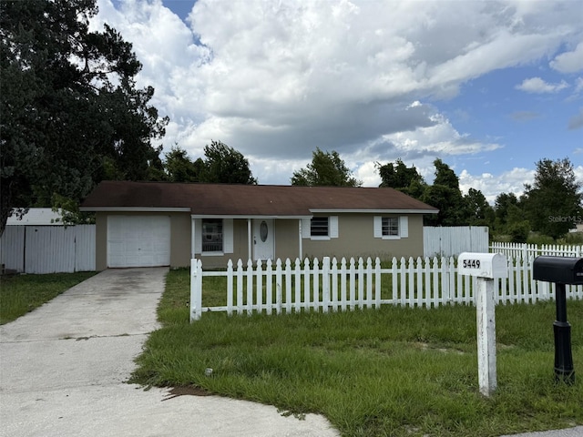 5449 NW 2nd St, Ocala, FL 34482 - single story home with concrete driveway, an attached garage, a fenced front yard, and stucco siding