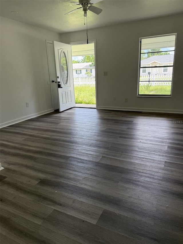 5449 NW 2nd St, Ocala, FL 34482 - foyer entrance featuring a ceiling fan and dark wood-type flooring