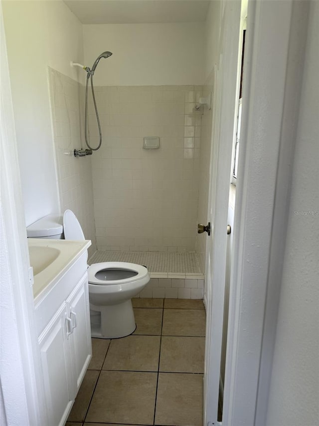 5449 NW 2nd St, Ocala, FL 34482 - bathroom featuring a stall shower, tile patterned flooring, and vanity