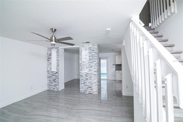 1101 Sandestin Way, Orlando, FL 32824 - unfurnished living room with stairway, ceiling fan, and a textured ceiling