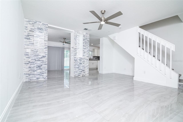 1101 Sandestin Way, Orlando, FL 32824 - unfurnished living room featuring a ceiling fan and stairway