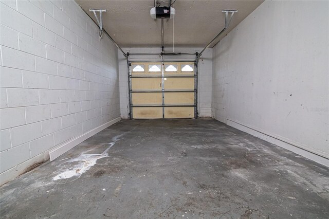1101 Sandestin Way, Orlando, FL 32824 - garage featuring a garage door opener and concrete block wall
