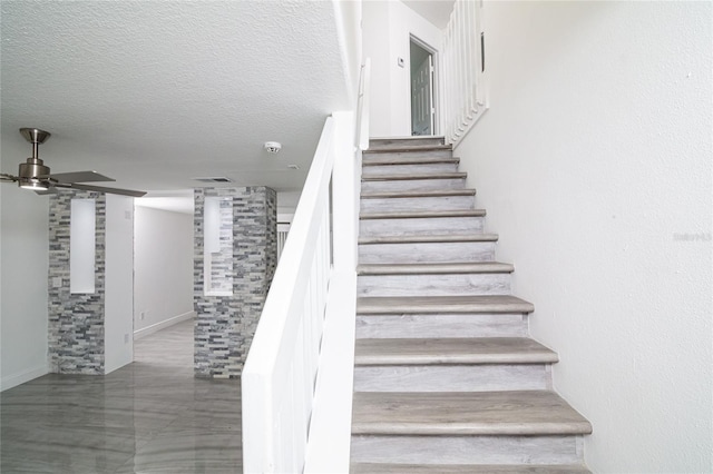 1101 Sandestin Way, Orlando, FL 32824 - stairs with a ceiling fan and baseboards