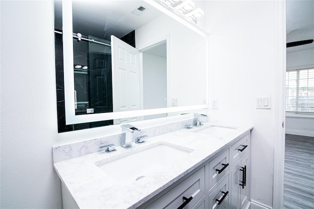 1101 Sandestin Way, Orlando, FL 32824 - bathroom with double vanity and a shower with door