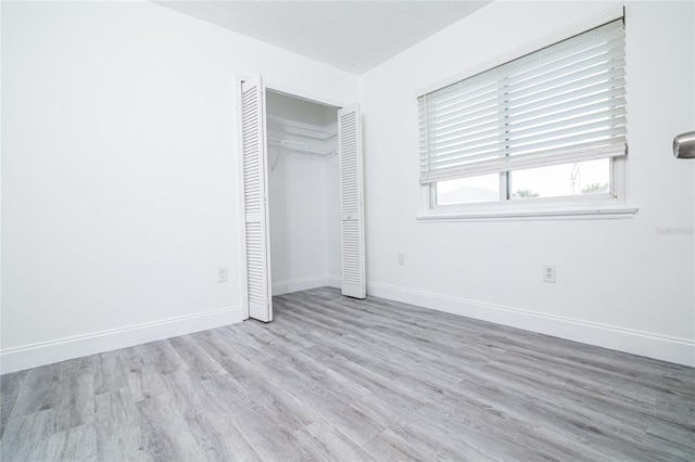 1101 Sandestin Way, Orlando, FL 32824 - unfurnished bedroom featuring wood finished floors and a closet