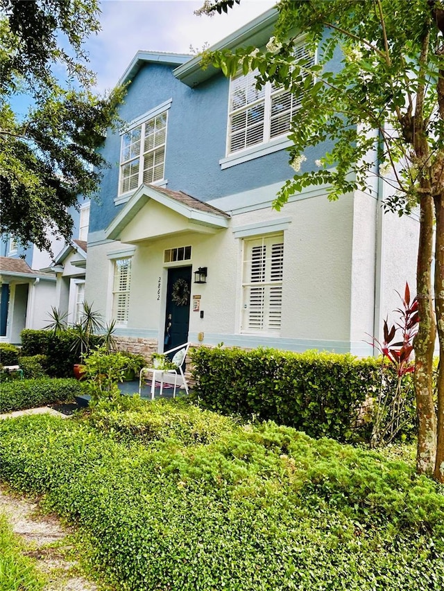 2862 Grasmere View Pkwy, Kissimmee, FL 34746 - view of front of home with stucco siding