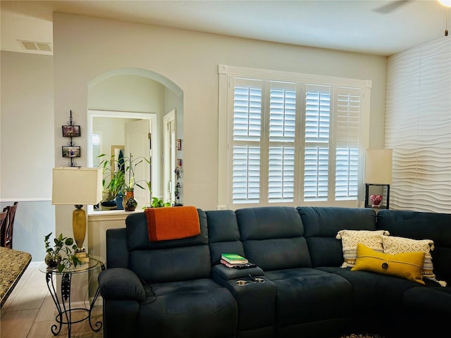 2862 Grasmere View Pkwy, Kissimmee, FL 34746 - living area with arched walkways, plenty of natural light, and wood finished floors
