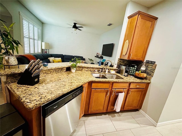 2862 Grasmere View Pkwy, Kissimmee, FL 34746 - kitchen featuring dishwasher, ceiling fan, light stone counters, a peninsula, and brown cabinetry