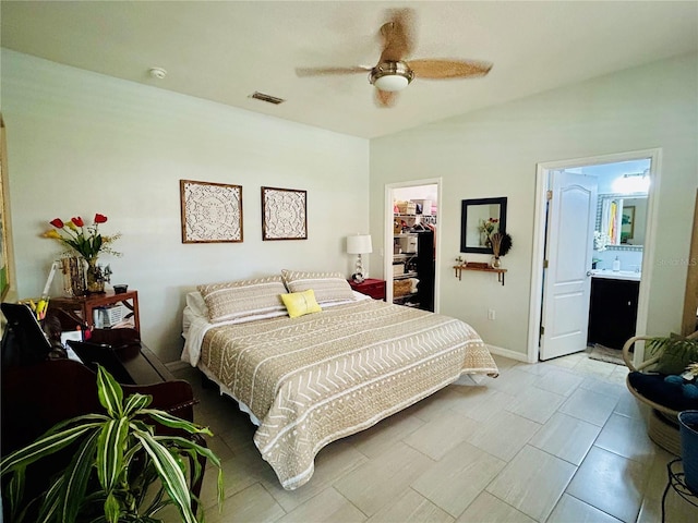 2862 Grasmere View Pkwy, Kissimmee, FL 34746 - bedroom with a spacious closet, a closet, ceiling fan, and ensuite bath
