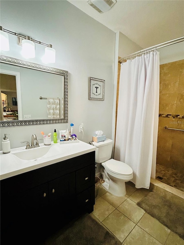 2862 Grasmere View Pkwy, Kissimmee, FL 34746 - bathroom featuring vanity, tile patterned flooring, and a tile shower