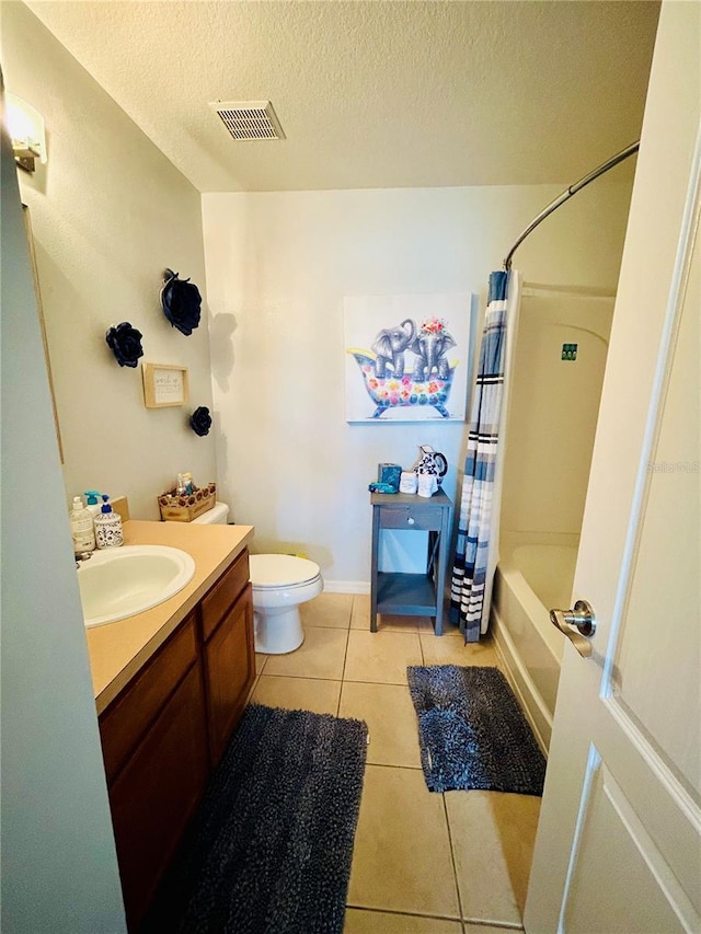 2862 Grasmere View Pkwy, Kissimmee, FL 34746 - bathroom with tile patterned flooring, vanity, shower / tub combo with curtain, and a textured ceiling