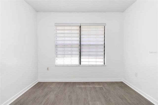 840 Center Ave Unit 80, Daytona Beach, FL 32117 - empty room with wood finished floors and healthy amount of natural light