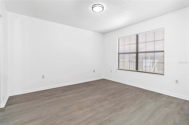 840 Center Ave Unit 80, Daytona Beach, FL 32117 - spare room featuring wood finished floors and a textured ceiling