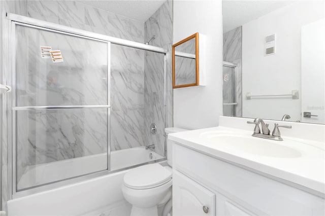 840 Center Ave Unit 80, Daytona Beach, FL 32117 - bathroom with vanity, shower / bath combination with glass door, and a textured ceiling