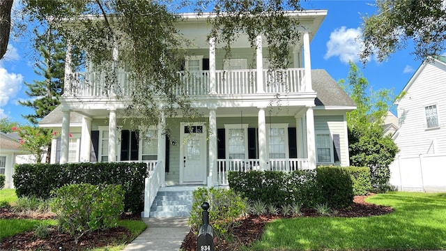 934 Westpark Dr, Celebration, FL 34747 - neoclassical home with covered porch and a balcony