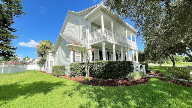 934 Westpark Dr, Celebration, FL 34747 - view of front facade with a balcony and covered porch
