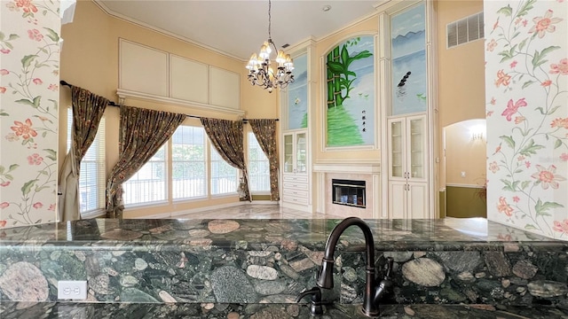 934 Westpark Dr, Celebration, FL 34747 - dining room featuring a chandelier and a tile fireplace