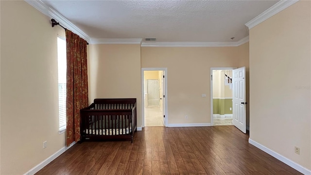 934 Westpark Dr, Celebration, FL 34747 - unfurnished bedroom featuring hardwood / wood-style flooring and ornamental molding